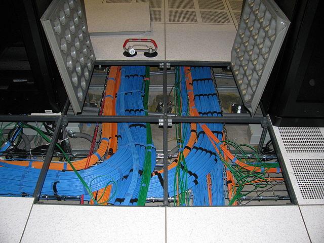 Under-floor fiber optic cable installation